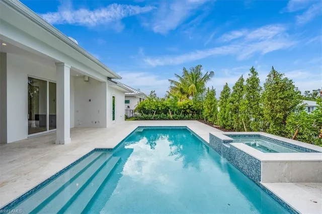 a view of a swimming pool with a patio