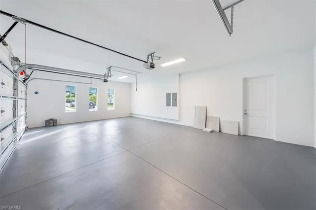 a view of a livingroom with a ceiling fan and window