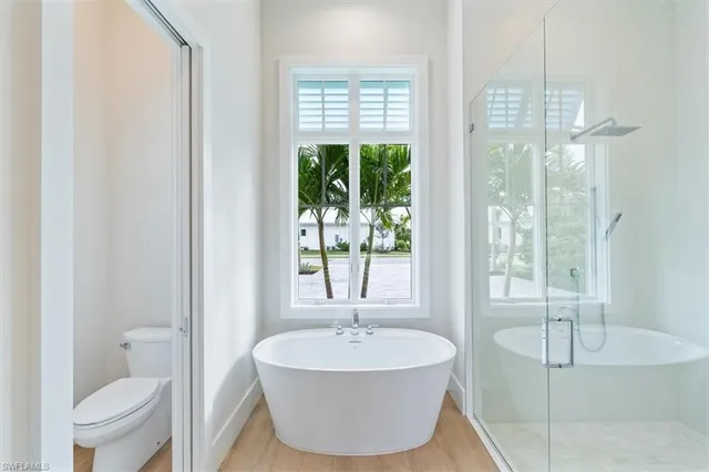 a bathroom with a tub and a sink