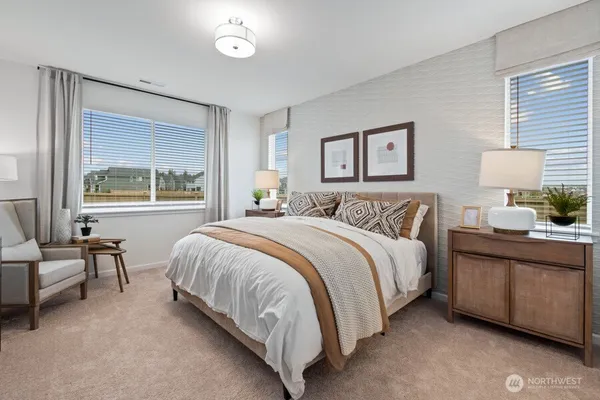 a spacious bedroom with a bed and a table
