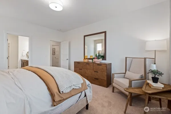 a bedroom with a bed and a dresser