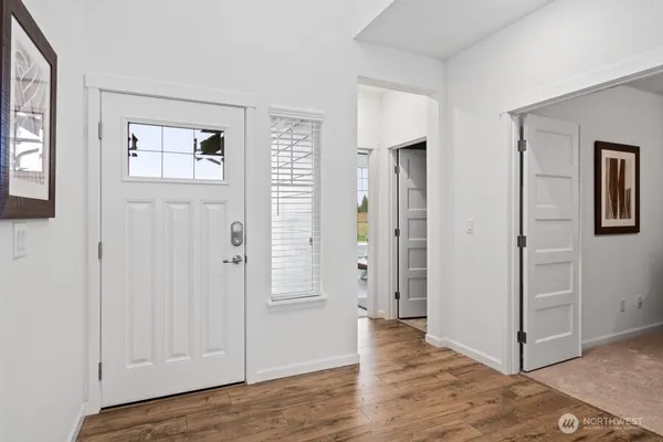 wooden floor with white walls