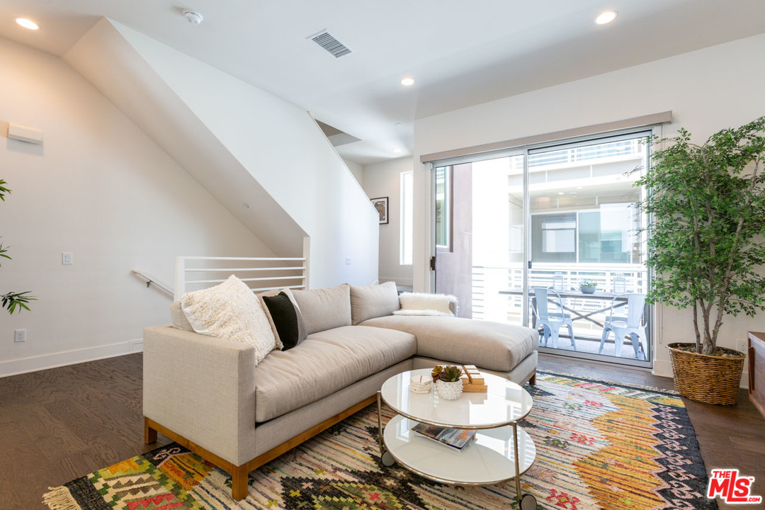 2209 Polyscope Place Los Angeles, CA 90026 - Photo 14 of 37 a living room with furniture and a large window
