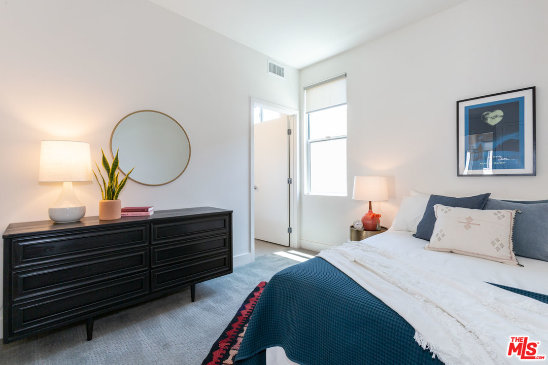 2209 Polyscope Place Los Angeles, CA 90026 - Photo 19 of 37 a bedroom with a bed and a dresser
