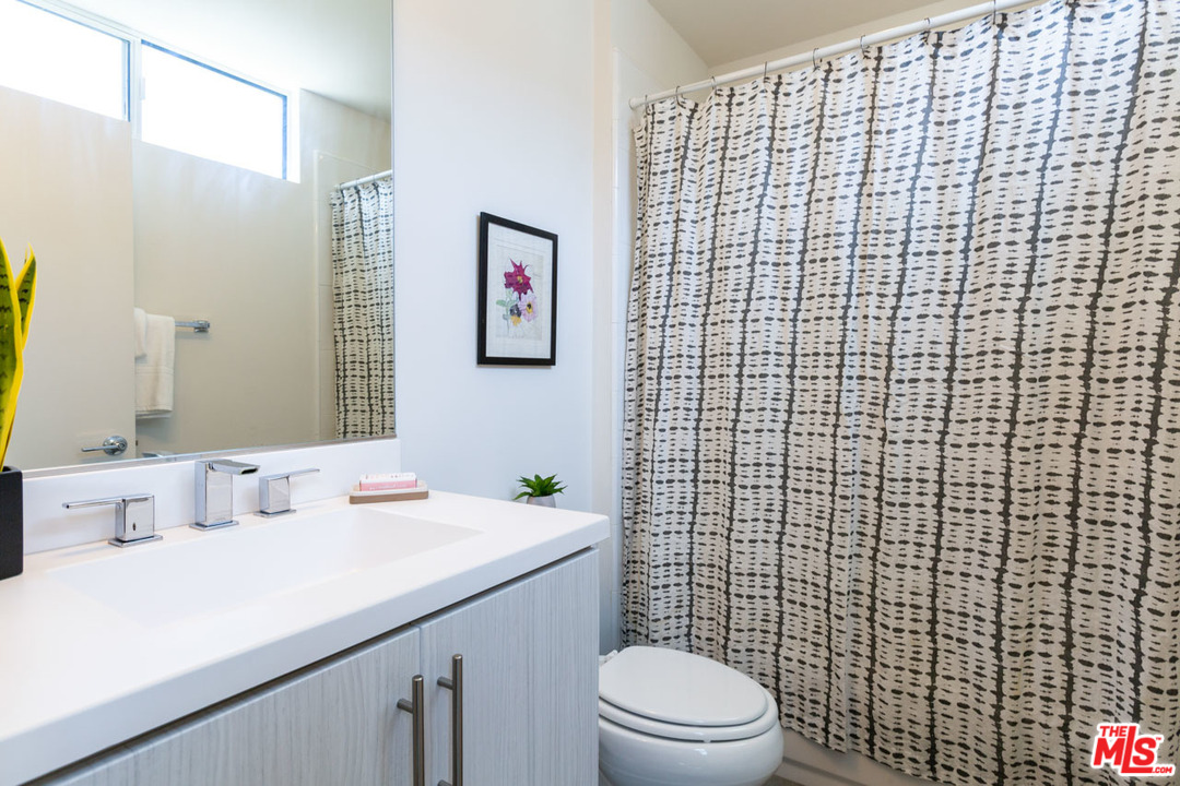 2209 Polyscope Place Los Angeles, CA 90026 - Photo 20 of 37 a bathroom with a sink a toilet and shower