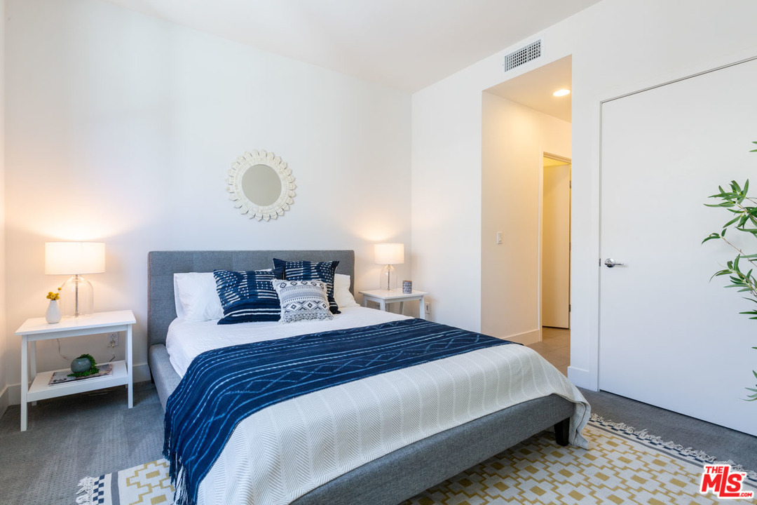 2209 Polyscope Place Los Angeles, CA 90026 - Photo 22 of 37 a bedroom with a bed and a window
