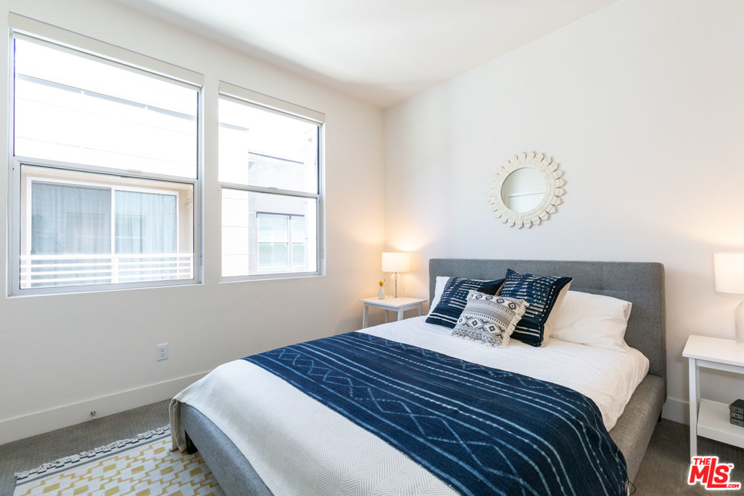 2209 Polyscope Place Los Angeles, CA 90026 - Photo 24 of 37 a bedroom with a bed and a window
