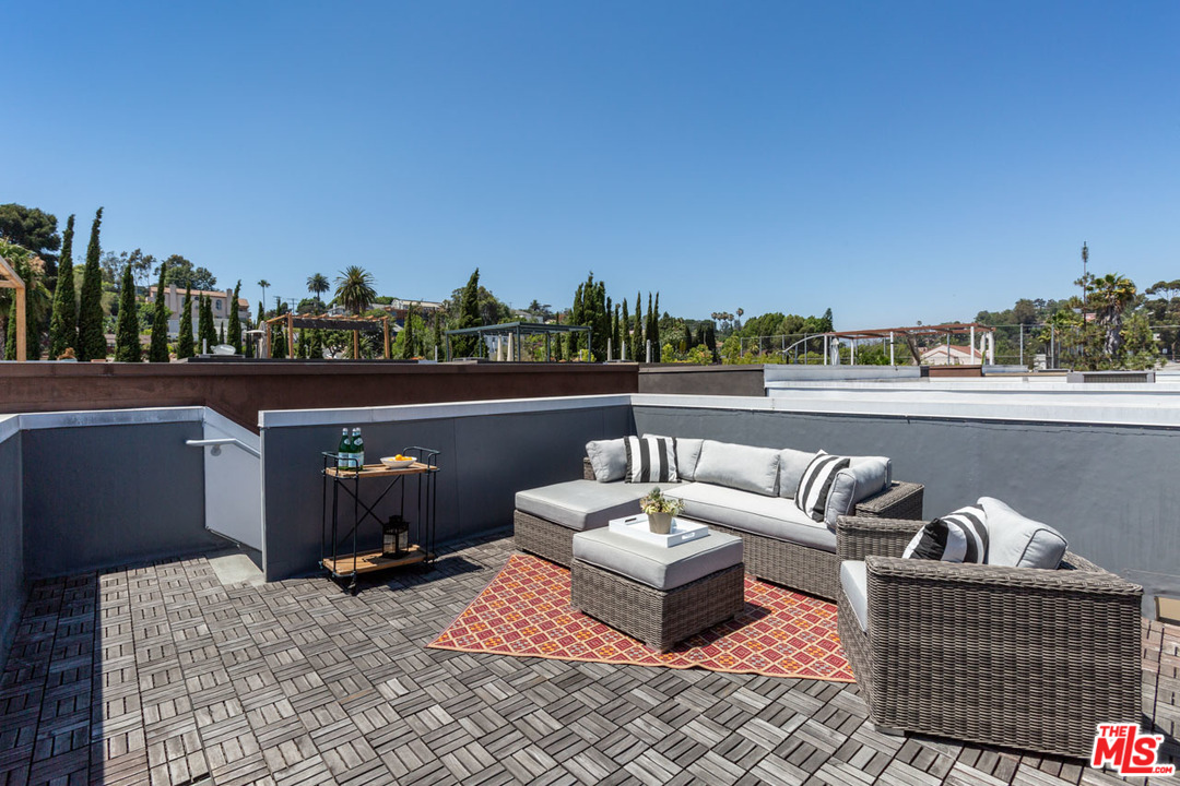 2209 Polyscope Place Los Angeles, CA 90026 - Photo 28 of 37 a view of roof deck with couches and city view
