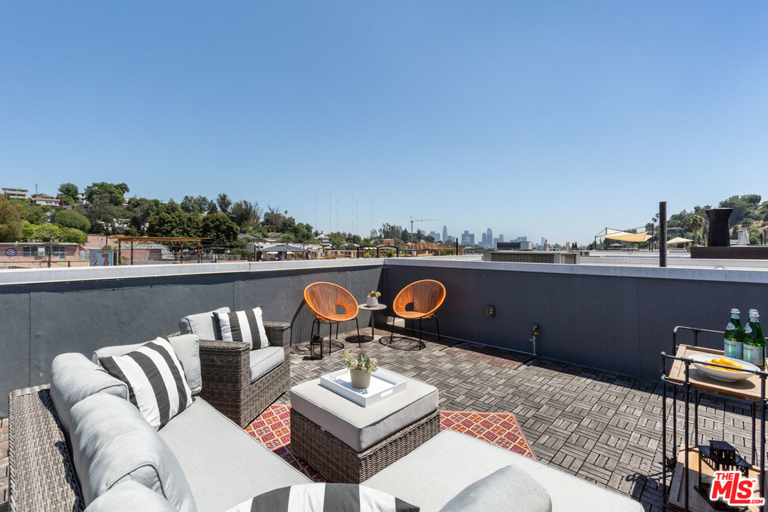 2209 Polyscope Place Los Angeles, CA 90026 - Photo 30 of 37 a couch sitting in a roof with a city view