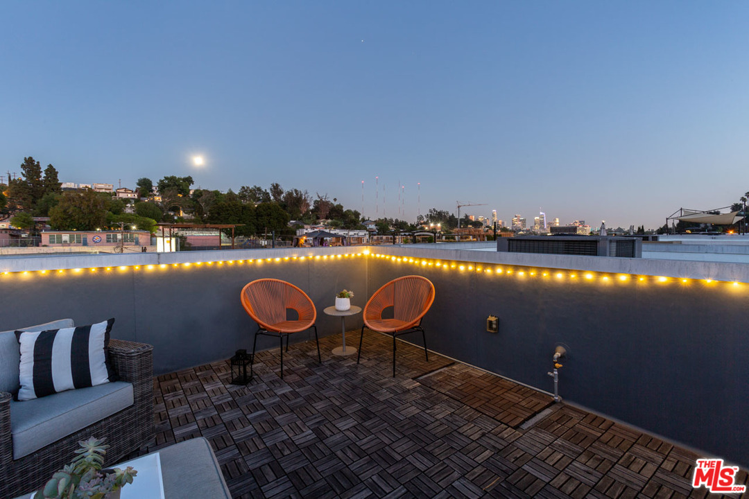 2209 Polyscope Place Los Angeles, CA 90026 - Photo 31 of 37 a view of a lake with couches chairs and city view