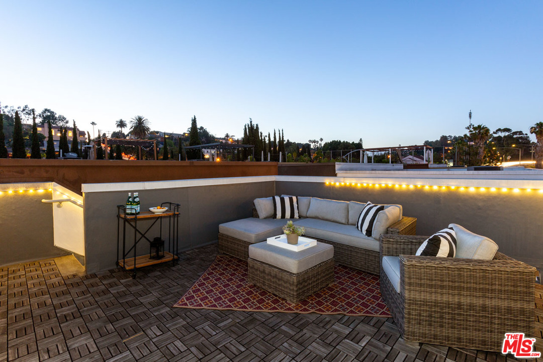 2209 Polyscope Place Los Angeles, CA 90026 - Photo 32 of 37 a roof deck with couches and city view