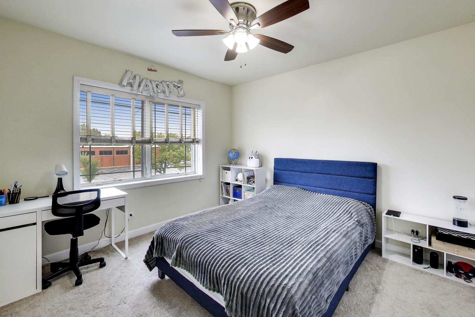 77 North Wolf Road, Unit 312 Melrose Park, IL 60164 - Photo 12 of 20 a bedroom with a bed and a window