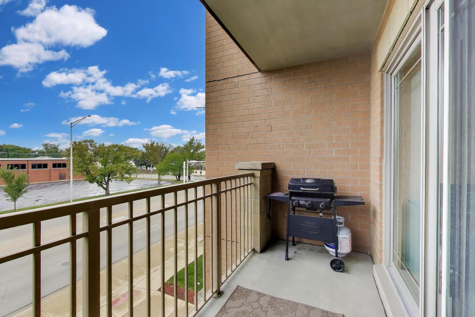 77 North Wolf Road, Unit 312 Melrose Park, IL 60164 - Photo 16 of 20 a view of a balcony with chairs