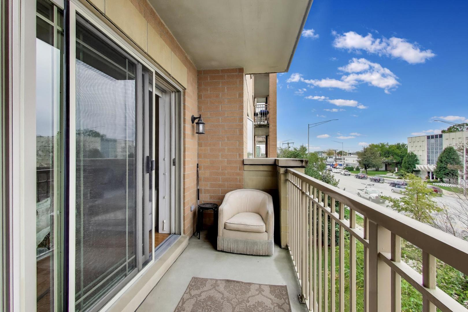 77 North Wolf Road, Unit 312 Melrose Park, IL 60164 - Photo 17 of 20 a balcony view with a potted plant