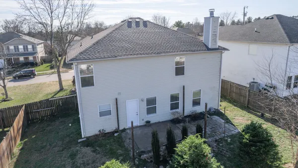 a house view with a backyard space