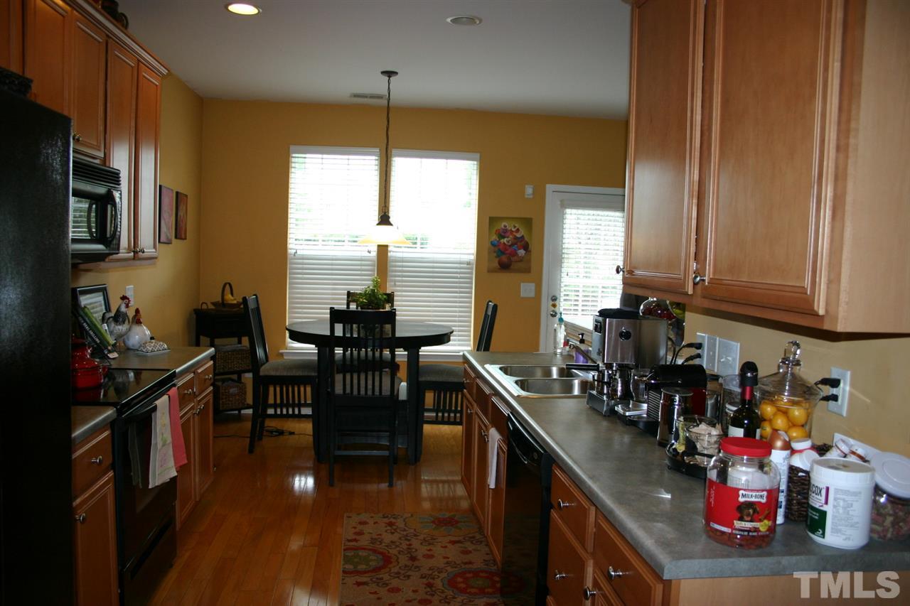 8207 Beaded Stone Street Raleigh, NC 27613 - Photo 3 of 23 a kitchen with lots of counter top space