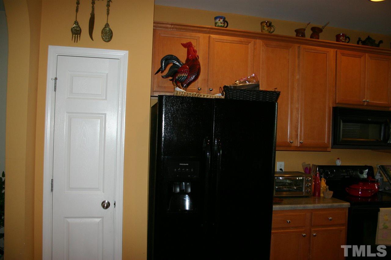 8207 Beaded Stone Street Raleigh, NC 27613 - Photo 4 of 23 a close view of a sink and cabinets