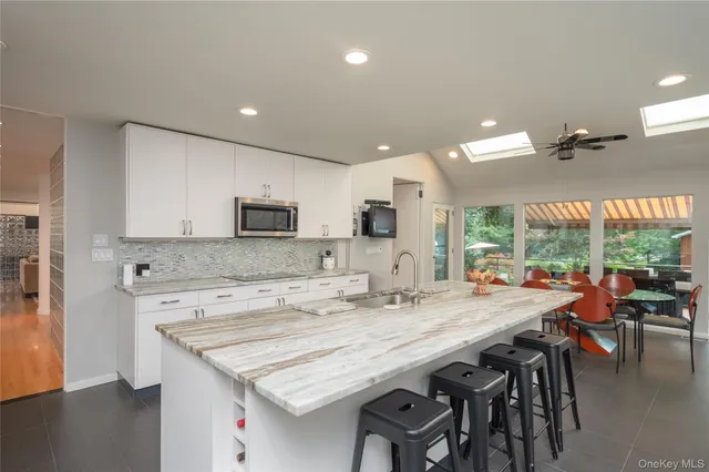 a kitchen with a table and chairs in it