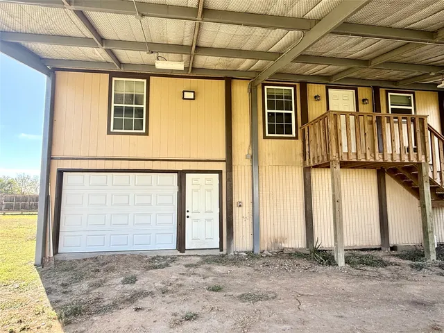 a view of a house with a wooden door