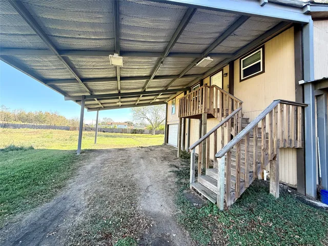 a view of a kitchen with a sink and a microwave