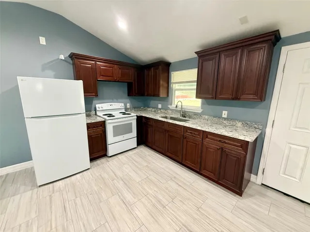 a view of porch with wooden floor