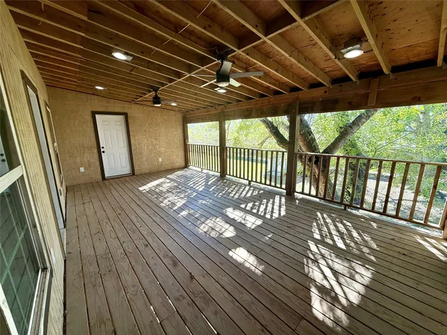 a view of balcony with wooden floor