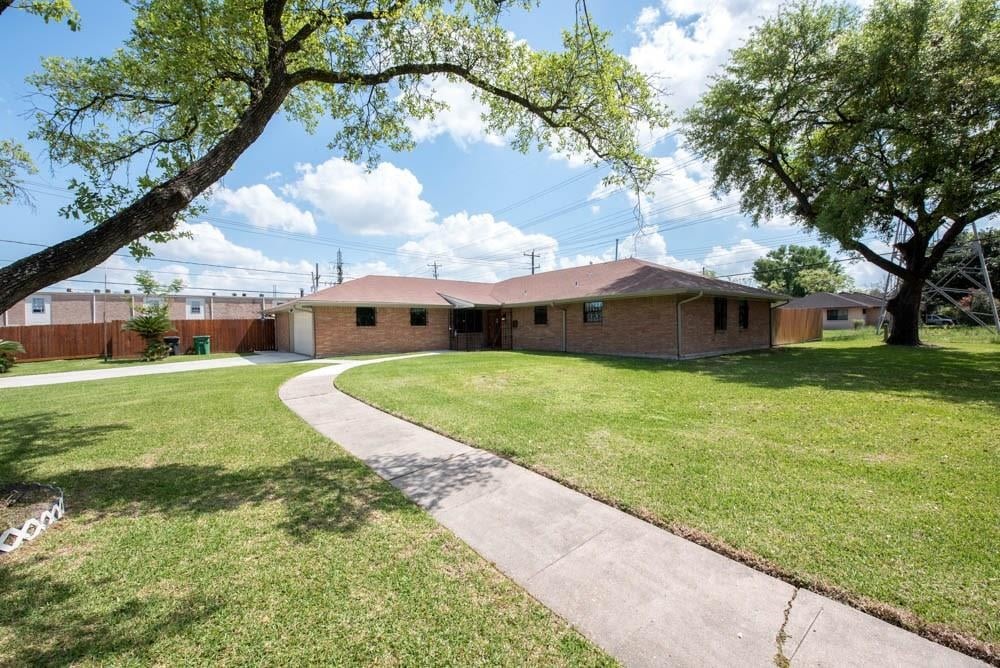 8419 Dover Street Houston, TX 77061 - Photo 1 of 15 a view of a house with a yard