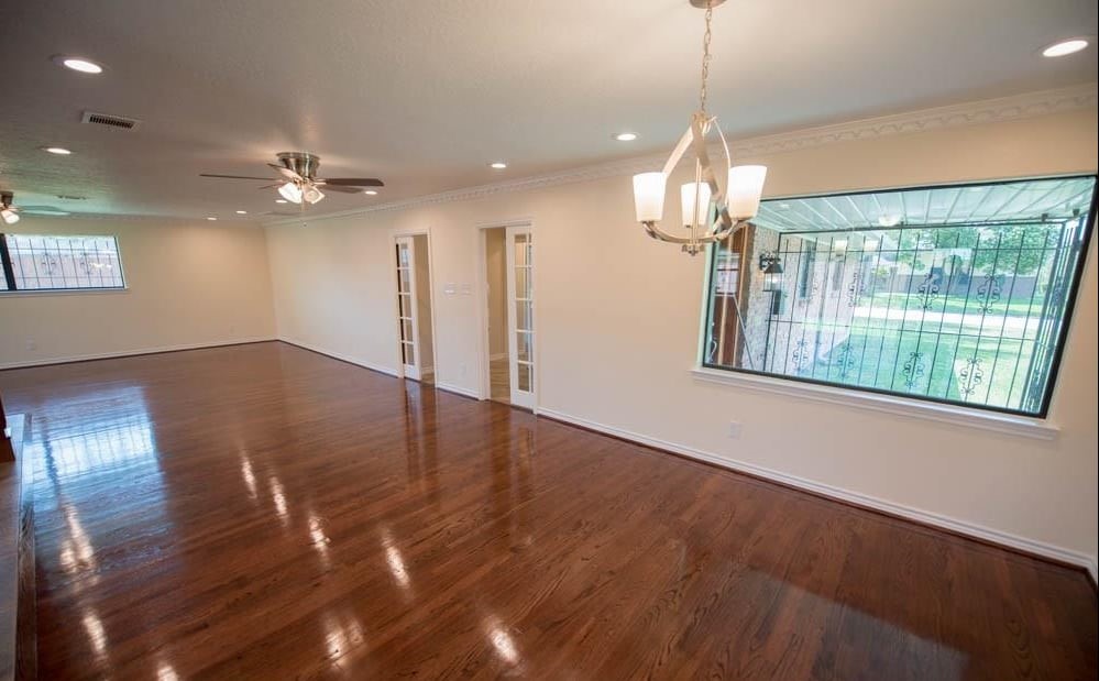 8419 Dover Street Houston, TX 77061 - Photo 2 of 15 a view of empty room with wooden floor and fan