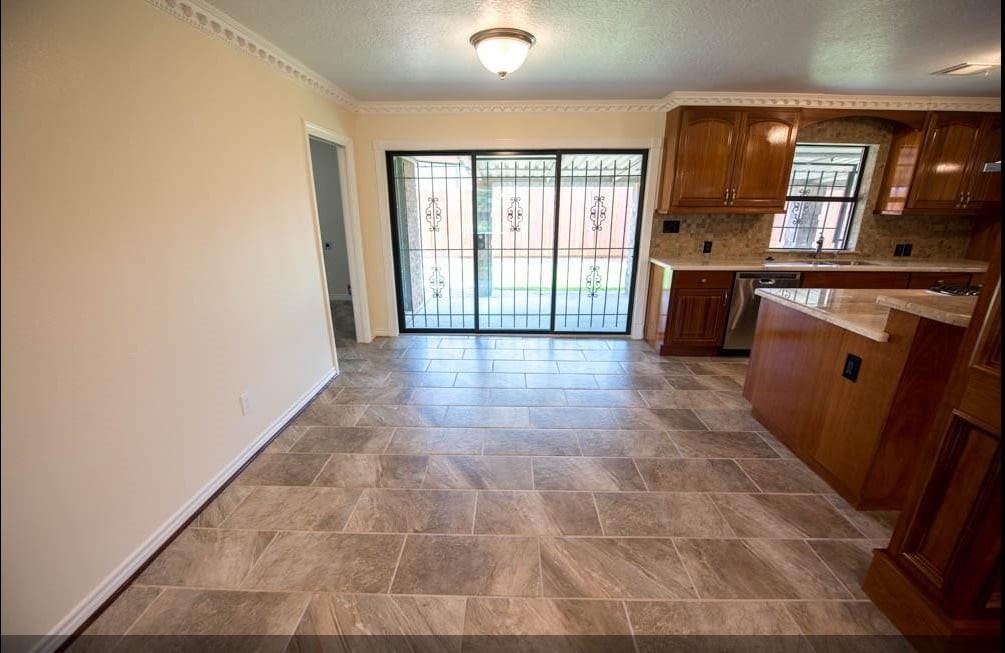 8419 Dover Street Houston, TX 77061 - Photo 10 of 15 an empty room with windows and entrance