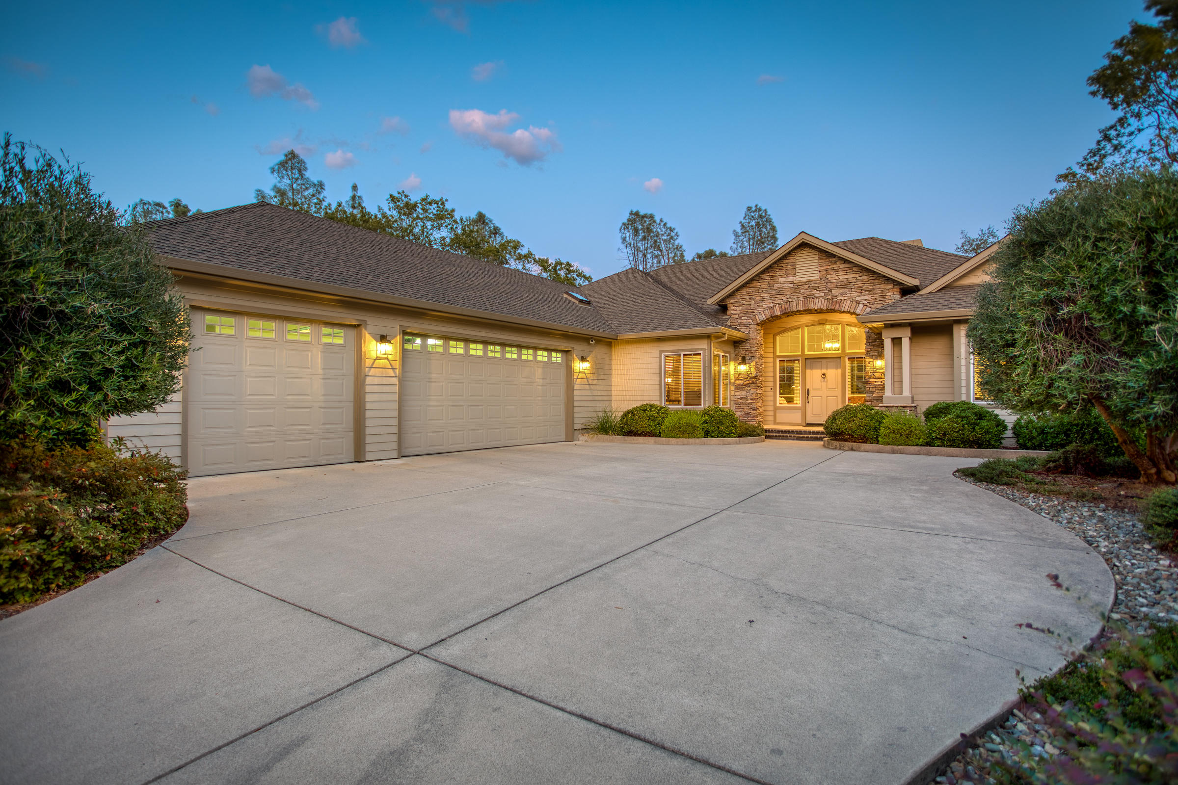 10163 Tilton Mine Road Redding, CA 96001 - Photo 1 of 144 a front view of a house with a yard and garage
