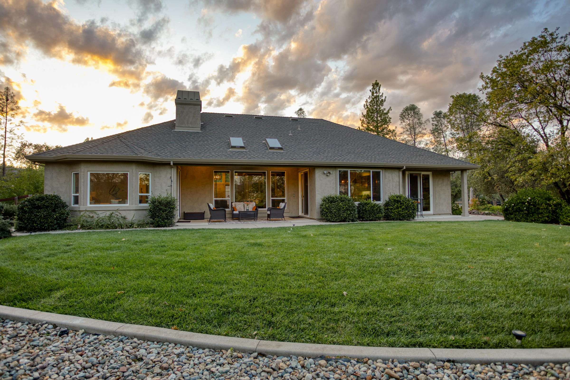 10163 Tilton Mine Road Redding, CA 96001 - Photo 47 of 144 a front view of a house with a garden