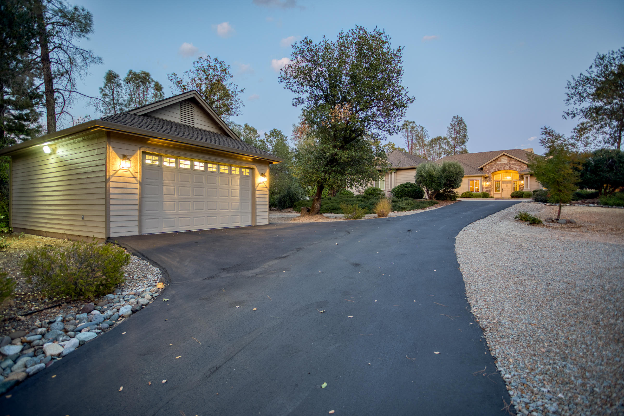 10163 Tilton Mine Road Redding, CA 96001 - Photo 58 of 144 a view of a house with a yard and garage