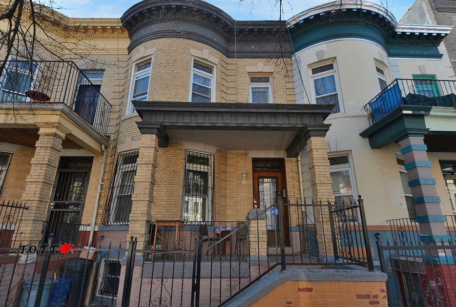 a front view of a house with parking