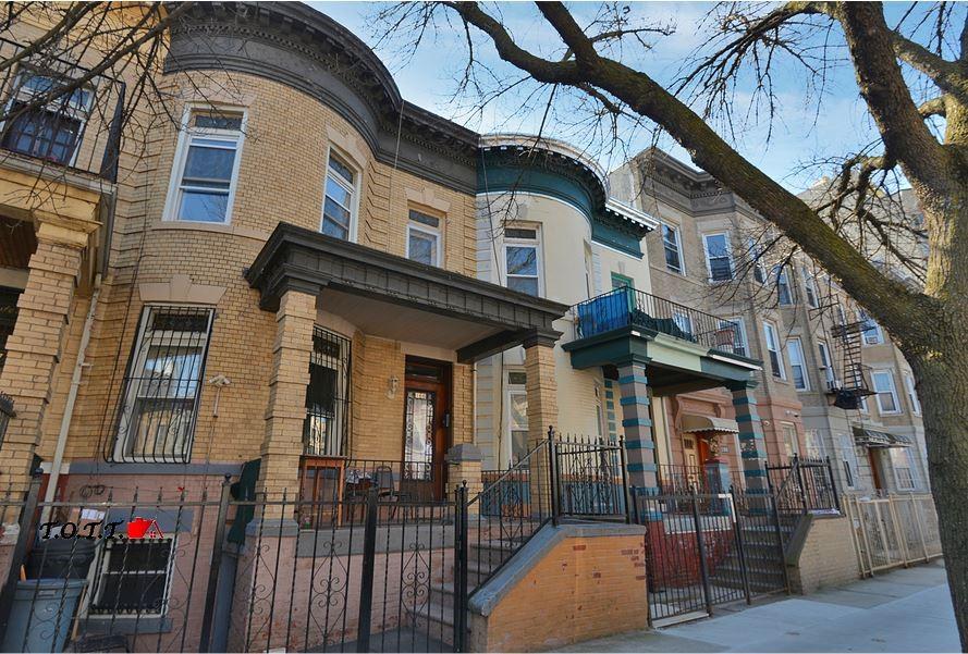 166 Martense Street Brooklyn, NY 11226 - Photo 2 of 14 a view of a building with a iron gate