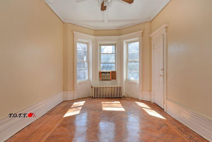 166 Martense Street Brooklyn, NY 11226 - Photo 4 of 14 a view of an empty room with a window