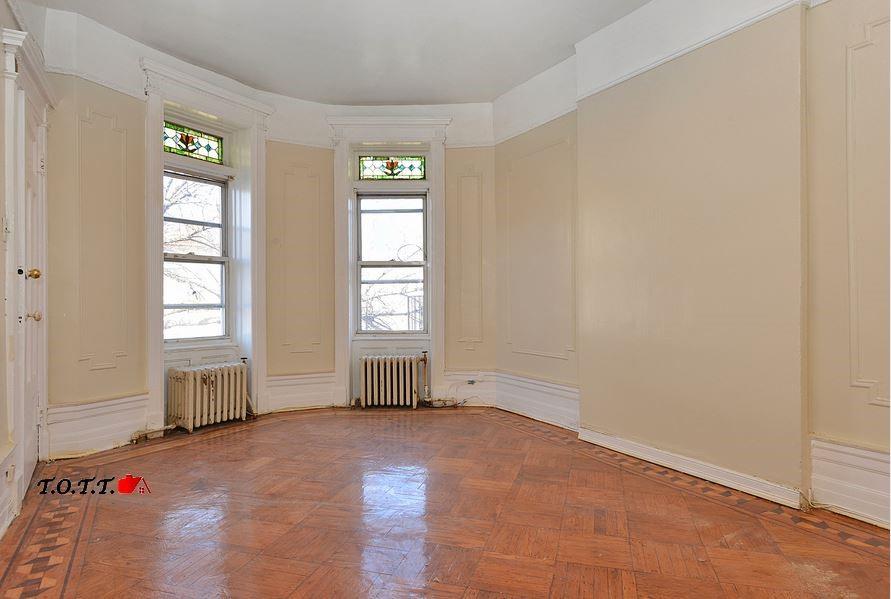 166 Martense Street Brooklyn, NY 11226 - Photo 9 of 14 an empty room with windows