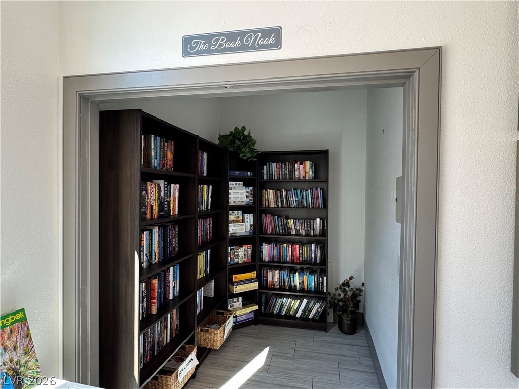 2555 Hampton Road, Unit 4205 Henderson, NV 89052 - Photo 38 of 52 This cozy library nook features ample shelving and provides a perfect retreat for reading and relaxation.