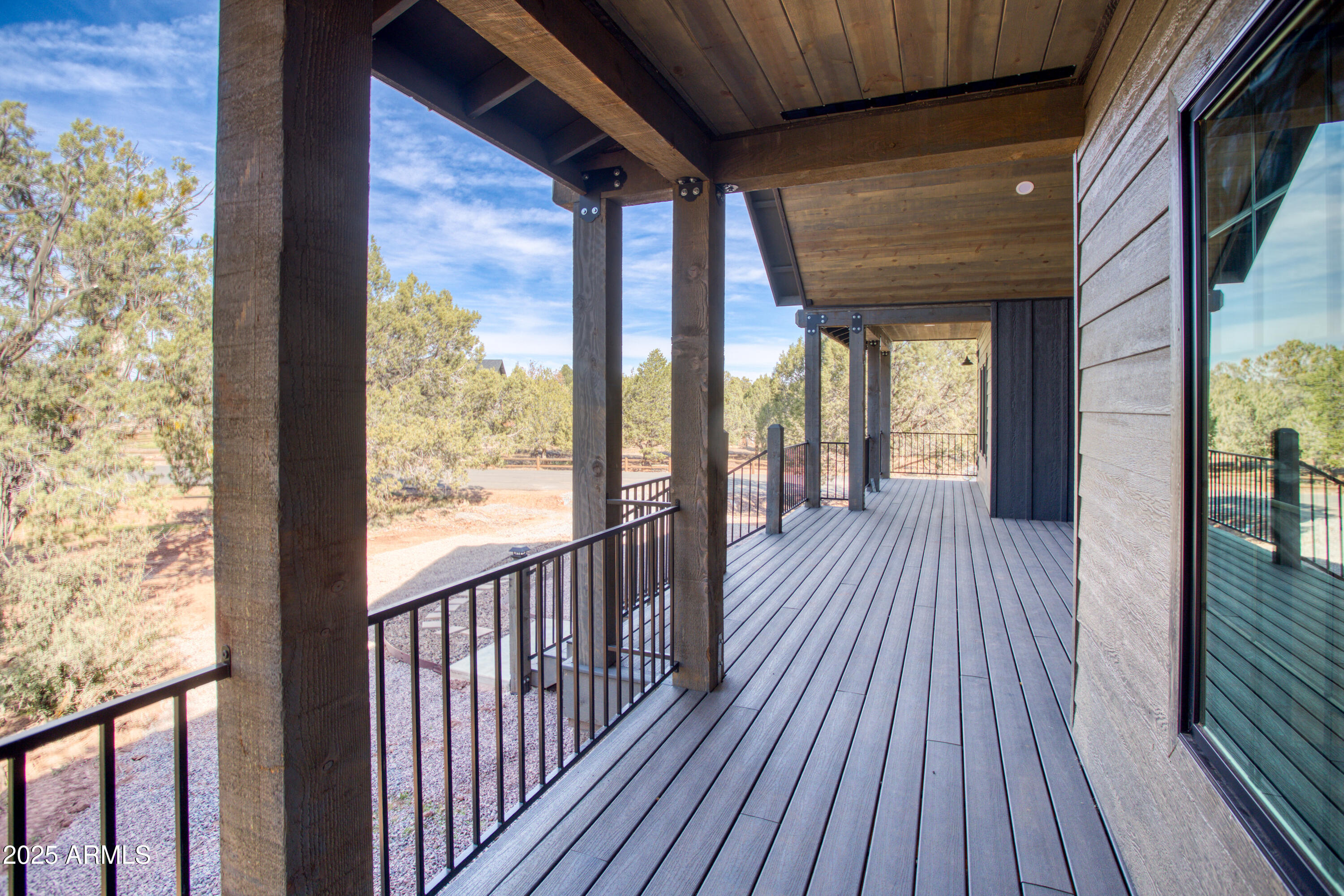 957 Cheney Ranch Loop Show Low, AZ 85901 - Photo 9 of 32 a view of a balcony with wooden floor