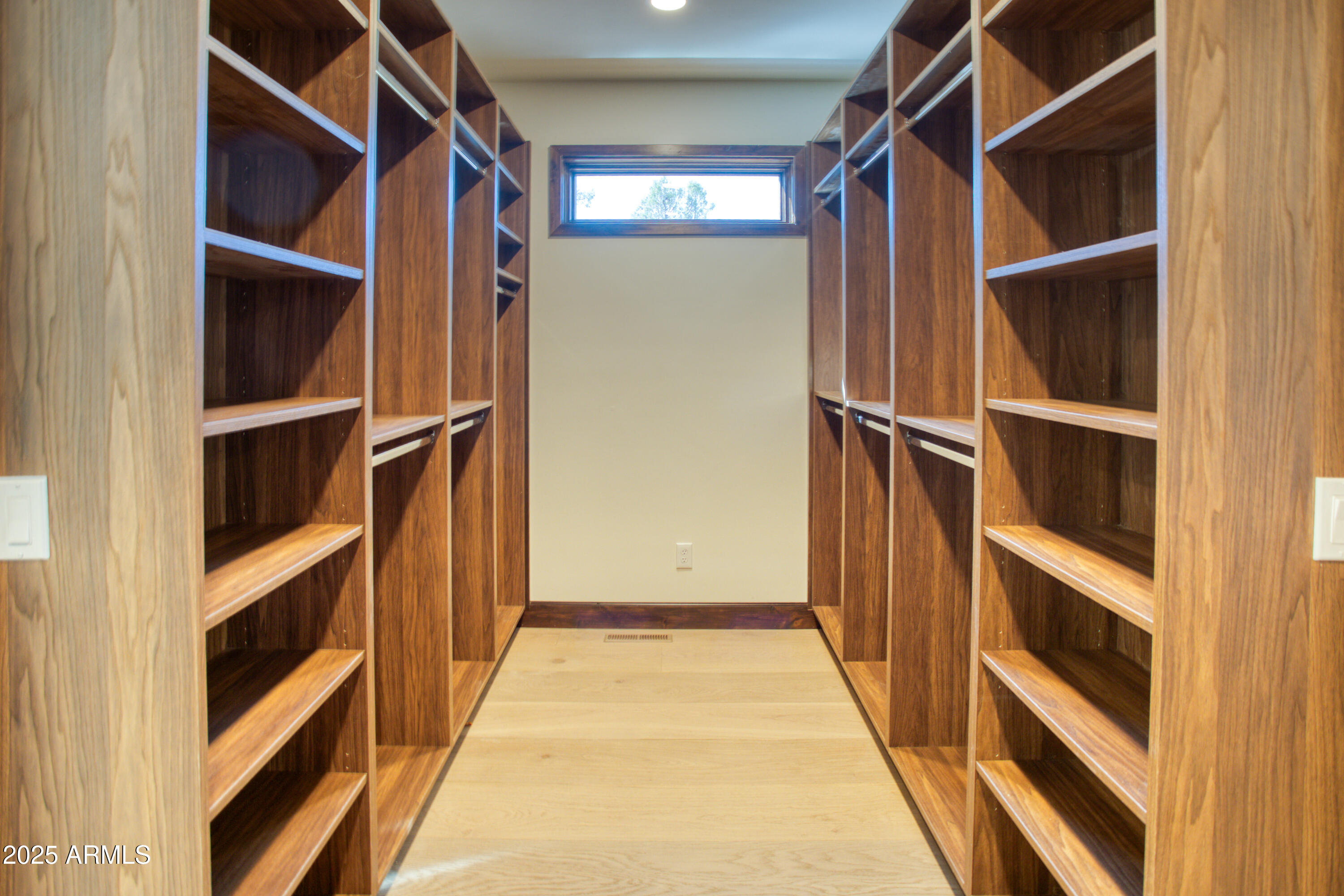 957 Cheney Ranch Loop Show Low, AZ 85901 - Photo 16 of 32 a view of walk in closet with empty racks
