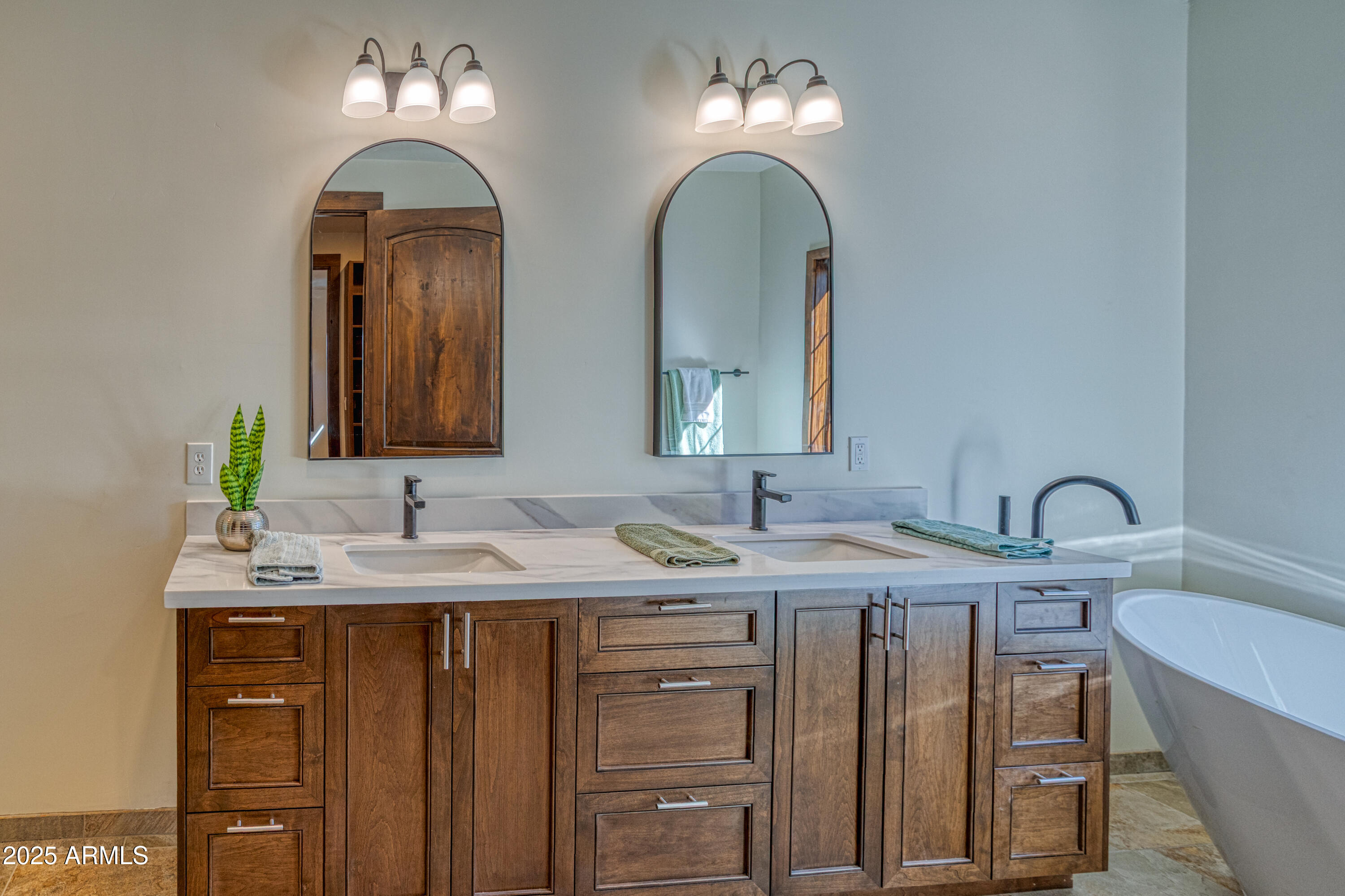 957 Cheney Ranch Loop Show Low, AZ 85901 - Photo 18 of 32 a bathroom with double vanity sinks a vanity and a mirror