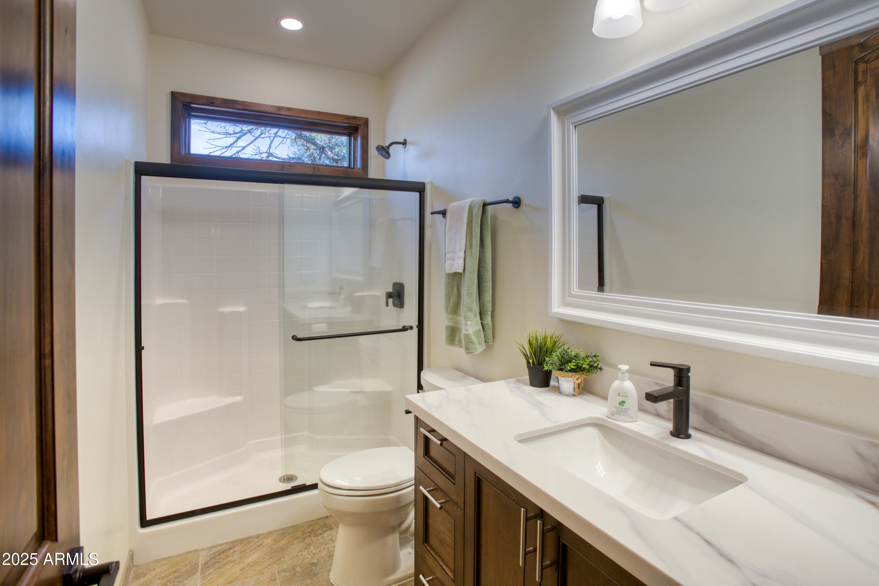 957 Cheney Ranch Loop Show Low, AZ 85901 - Photo 23 of 32 a bathroom with a sink a toilet and shower