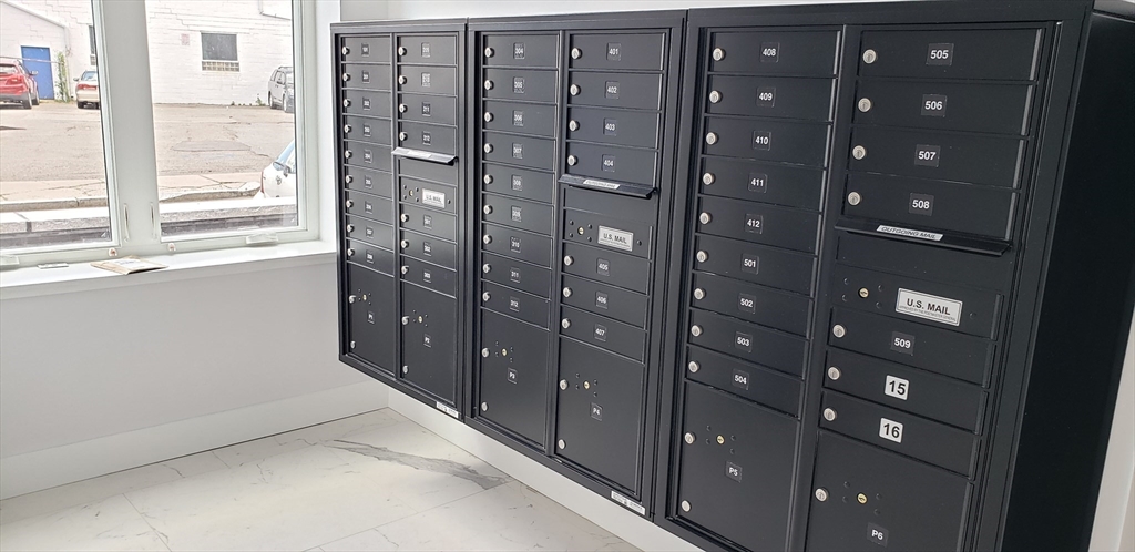 50 Hichborn Street, Unit 311 Boston, MA 02135 - Photo 5 of 19 a view of entryway with windows and chandelier