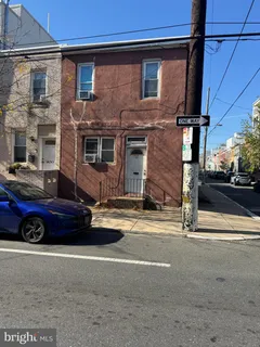a front view of a house with parking area