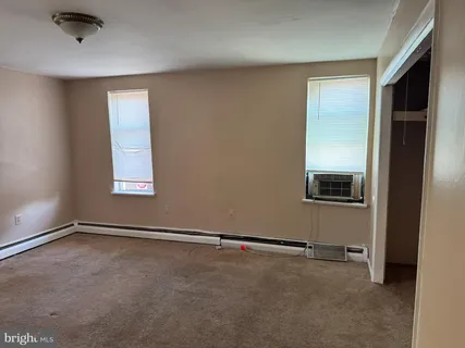 an empty room with windows