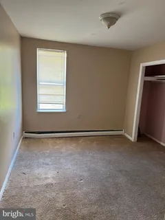 an empty room with a empty space and a window