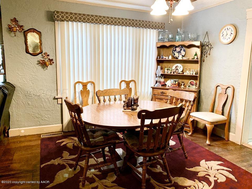 3701 South Van Buren Street Amarillo, TX 79110 - Photo 12 of 27 a view of a dining room with furniture and chandelier