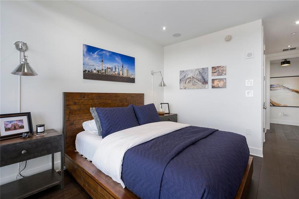 3630 Peachtree Road Northeast, Unit 2104 Atlanta, GA 30326 - Photo 55 of 98 a bedroom with a bed and a night stand