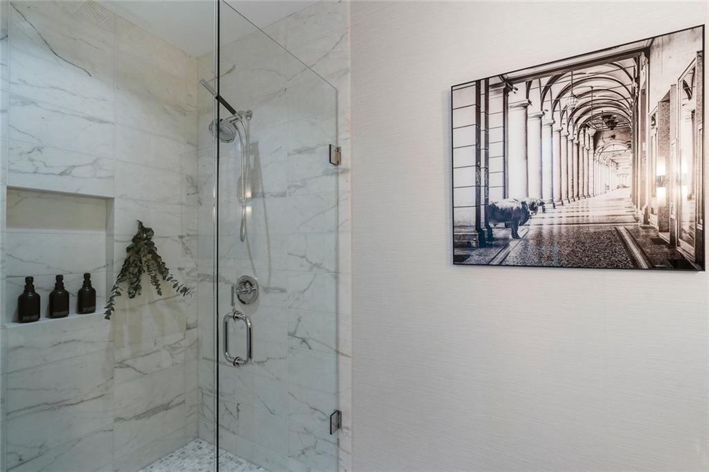3630 Peachtree Road Northeast, Unit 2104 Atlanta, GA 30326 - Photo 59 of 98 a very nice looking room with a glass door shower