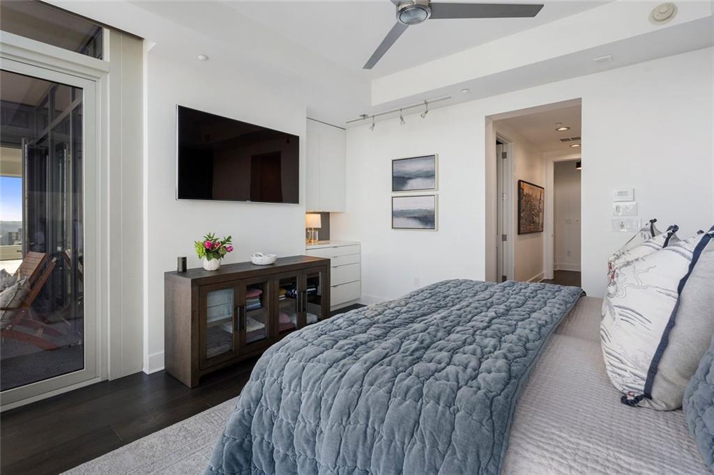 3630 Peachtree Road Northeast, Unit 2104 Atlanta, GA 30326 - Photo 63 of 98 a bedroom with a bed and a television