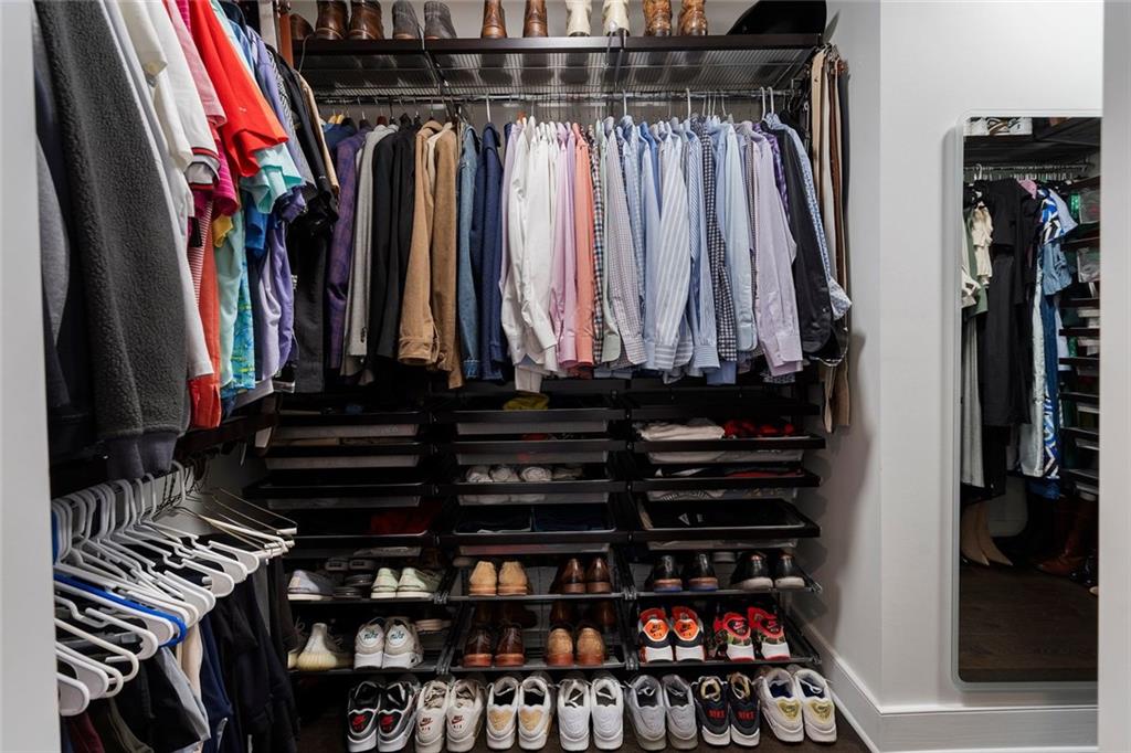 3630 Peachtree Road Northeast, Unit 2104 Atlanta, GA 30326 - Photo 64 of 98 a view of walk in closet with clothes and shoes